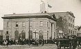 Looking east on Rosser Ave. at 11th St.: Merchants Bank Bldg (became library and Chamber of Commerce)