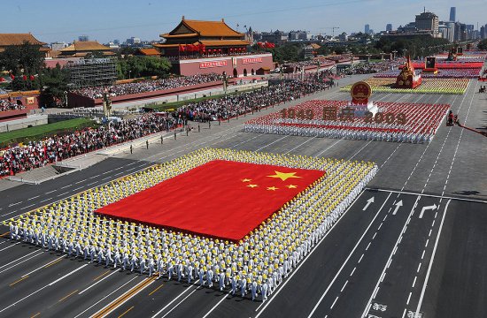 The phalanx of the national flag receives inspection in a parade in Beijing of the celebrations for the 60th anniversary of the founding of China on Thursday, Oct. 1, 2009