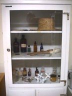 Display Case with Patient-Made Straw Hat