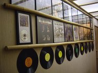 Bill and Sue-On Hillman Record Wall: Display of the duo's CDs, LPs, singles, covers, discs,
