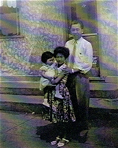 Sue-On holding cousin Marilyn with Uncle Henry Choy at Paris Cafe