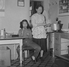 Sue-On and Mom taking kitchen break: circa 1960