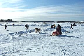 Outdoor skating ice on the river - winter road in background