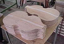 Beatle Bass tops-backs: computer machine carves out the bowl shapes