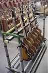 Basses awaiting tuning, intonation, truss rod adjustments