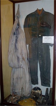 McCain Flight Suit and Parachute in Hanoi Hilton display