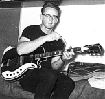 Guitar hermit in his room