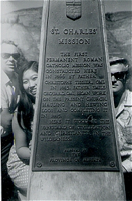 John, Sue-On, Jake at roadside monument for St. Charles Mission