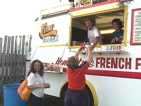 Sue-On at the Chip Truck being fed by our neighbour, Myron