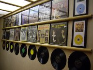 Bill and Sue-On Hillman Record Wall: Display of the duo's CDs, LPs, singles, covers, discs,