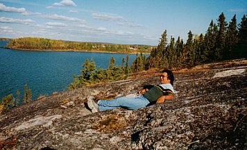 Robert Castel reclining in the mimikwisiwak hollows on the Granville Lake rock