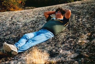 Robert Castel reclining in the mimikwisiwak hollows on the Granville Lake rock