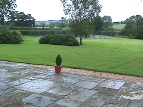 [8] View of the Grounds and Tennis Court from the Terrace