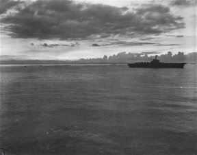 Flat top (A/C) passing PR at dawn near Leyte