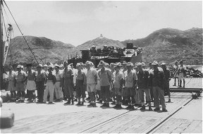 PR440: Japanese rounded up, PR landing parties. Japanese war memorial in background