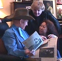 Russ  going over career clippings with Bill and Sue-On