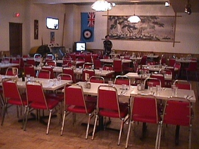 Robin Hillman making last minute table arrangements in Banquet Room #4