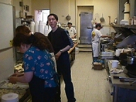 Sue-On and son, Robin, making final preparations before the arrival of the diners