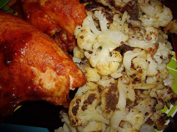 Sliced cauliflower, sprinkled with olive oil and Montreal steak spice